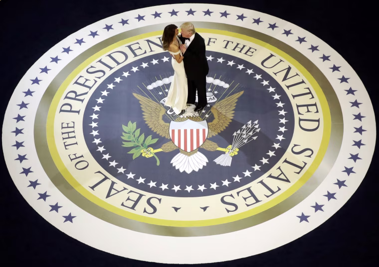 Image: President Donald Trump dances with first lady Melania Trump