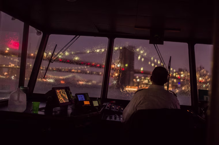 Image: A ferry travels on the East river from Manhattan to Brooklyn during a storm in New York