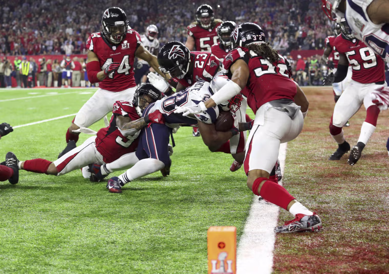 Image: New England Patriots' James White scores a touchdown during overtime to win the Super Bowl LI against the Atlanta Falcons in Houston