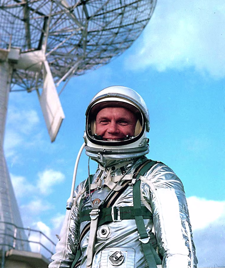Astronaut John Glenn wears a training version of a Mercury spacesuit during a break from training for the Mercury-Atlas 6 mission in 1962, when Glenn became the first American to orbit the Earth.