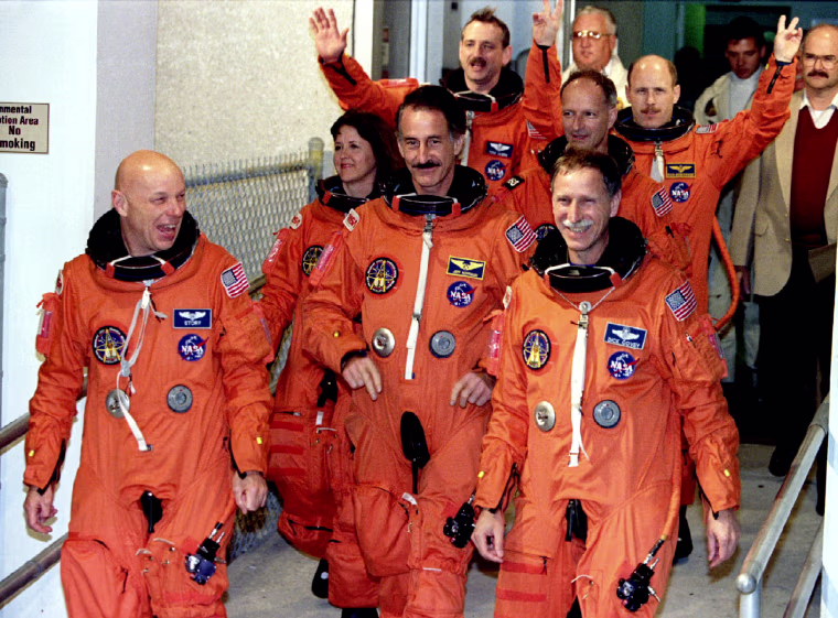 The crew of the space shuttle Endeavour is shown leaving their quarters for the launching pad Decemb..