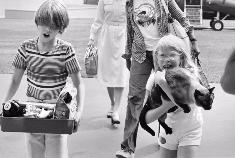 Image: President Carter's daughter holds her cat Misty
