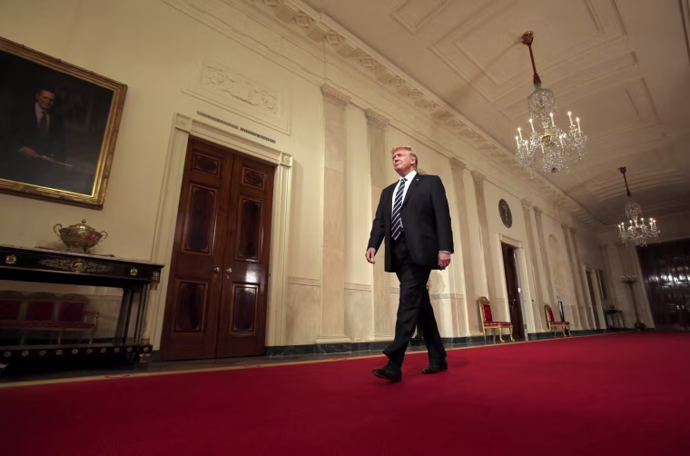 Image: President Donald Trump arrives to make an announcement at the White House