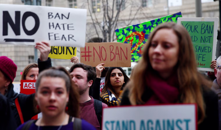 Image: Immigration activists rally outside of the U.S. Customs and Border Protection headquarters in Washington