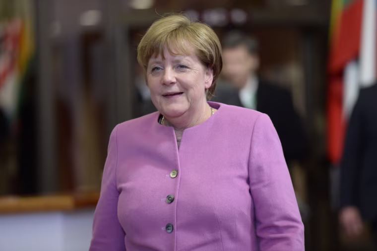 Image:  German Chancellor Angela Merkel talks to the media following the first day of a European Union Council Summit held at the European Union Council