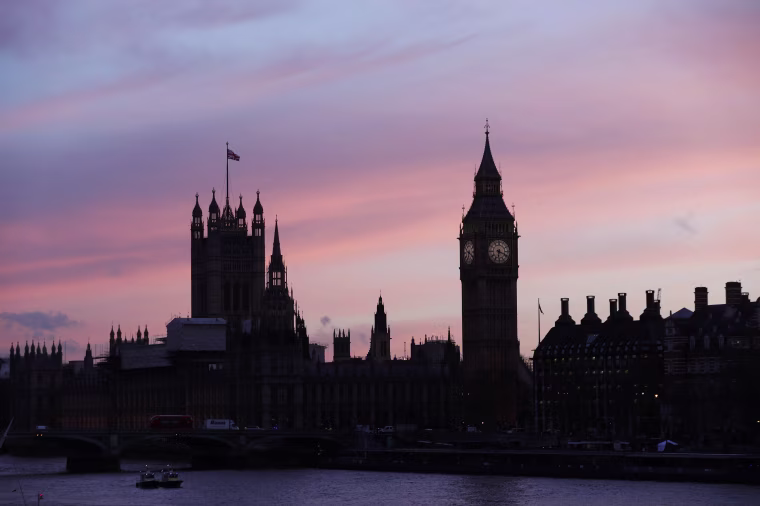 Image: The sun sets behind the Houses of Parliament after an attack on Westminster Bridge in London