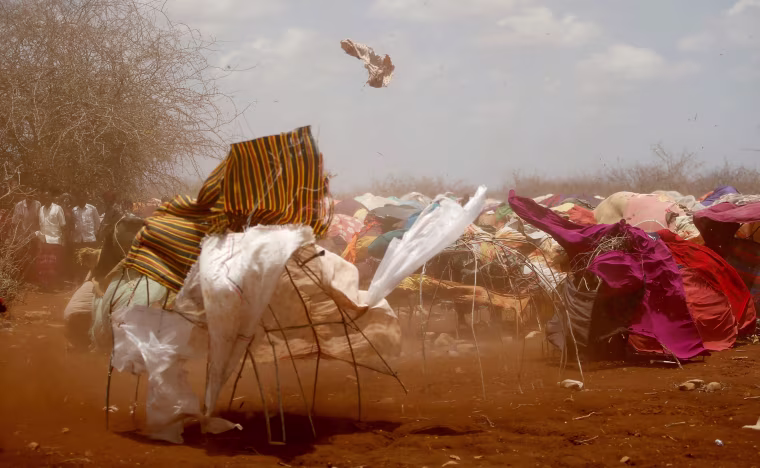 Image: A dust storm sweeps through the makeshift camp in Baidoa, March 26.