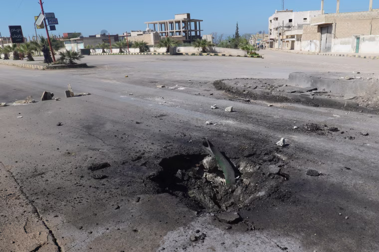 Image: A crater is seen at the site of an airstrike, after what rescue workers described as a suspected gas attack in the town of Khan Sheikhoun in rebel-held Idlib