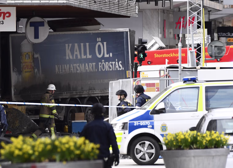 Image: Police cordon off the truck that crashed into the Ahlens department store at Drottninggatan in central Stockholm, April 7, 2017.