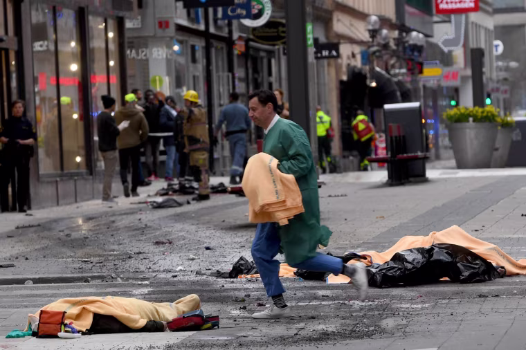 Image: At least 2 people are dead after a truck crashed into a crowd outside of a department store in downtown Stockholm, April 7, 2017.