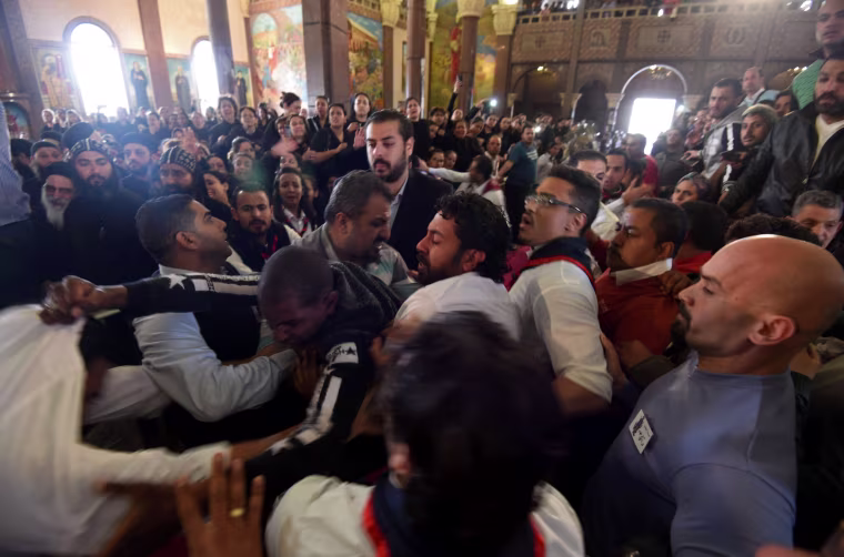 Image: Mourners react to the deaths of loved ones during a funeral procession at the Monastery of Marmina, April 10.