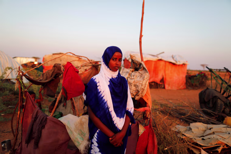 Image: The Wider Image: A daughter's freedom weighed against her siblings' lives