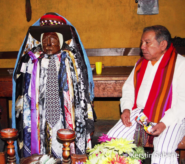 The statue of the Mayan demi-god Maximon is kept in the home of one of the members of his cofradia—the traditional brotherhood that cares for the Mayan saint—on Holy Week, he is transferred to his chapel near the Catholic Church