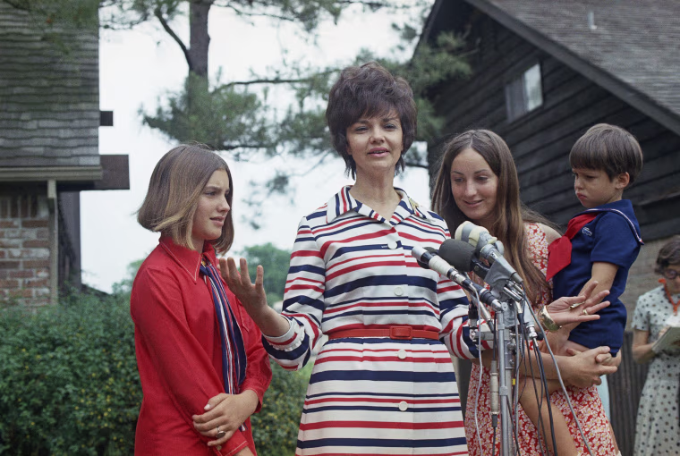 Marilyn Lovell is shown with her with children, from left, Susan, Barbara and Jeffrey, as she speaks to the media after her husband Jim Lovell's safe splashdown in Apollo 13 following its aborted lunar landing mission, April 17, 1970. (AP Photo)