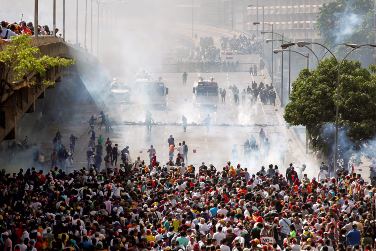 Image: Demonstrators clash with the police during protest in Venezuela
