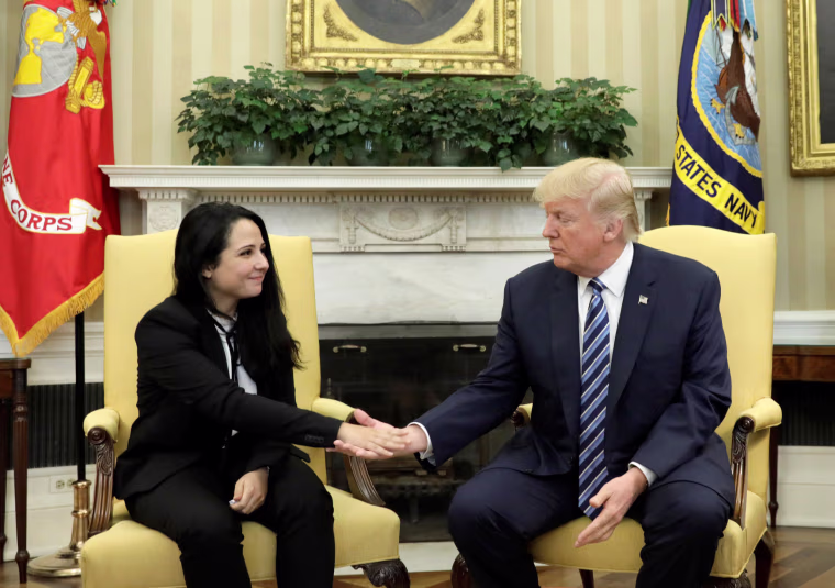 Image: Aya Hijazi, an Egyptian-American woman detained in Egypt for nearly three years on human trafficking charges, shakes hands with U.S. President Donald Trump in the Oval Office of the White House in Washington, April 21, 2017.