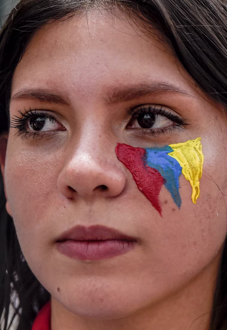 Image: A Venezuelan opposition activist marches against Venezuelan President Nicolas Maduro in Caracas