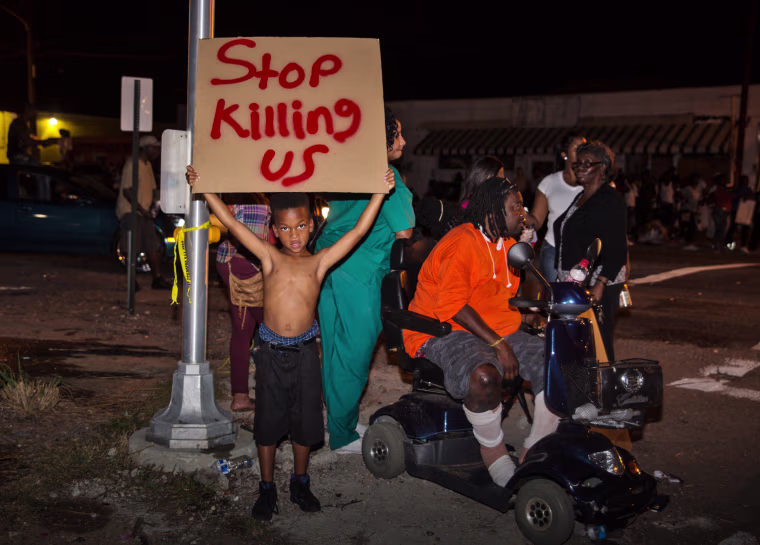 Image: People protest against the police shooting of Alton Sterling