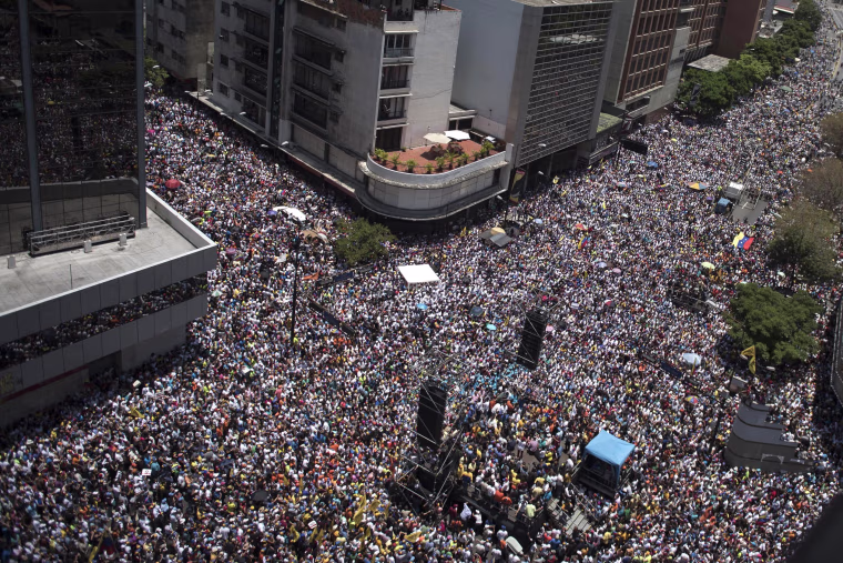 Image: Thousands of demonstrators protesting against Maduro's government march in Caracas on April 8, 2017.
