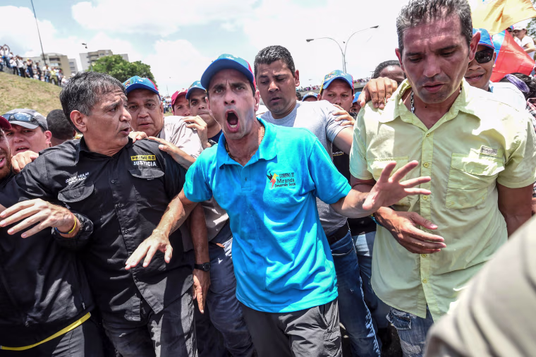 Image: Venezuelan opposition leader and former presidential candidate Henrique Capriles takes part in a protest on April 6, 2017 in Caracas.