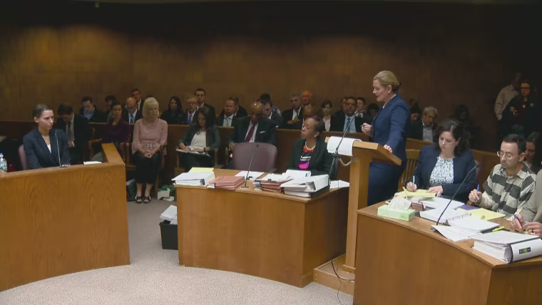 Former gymnast Rachel Denhollander, far left, testifies against Dr. Larry Nassar, far right, at a preliminary hearing on sexual assault charges.