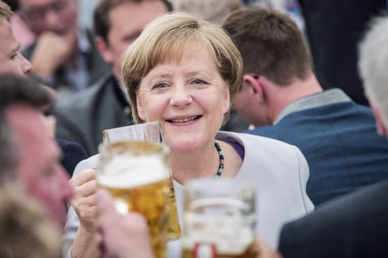 Image: German Chancellor Angela Merkel drinks from a beer during an election campaign event of the German Christian Social Union (CSU) party at the 46th Truderinger Festwoche festival week in Munich, Bavaria, Germany, May 28, 2017.