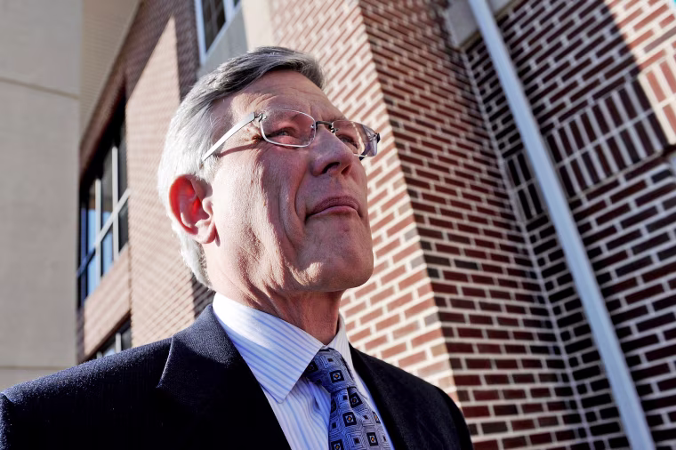 Image: Penn State athletic director Tim Curley walks out of the Magisterial District Court