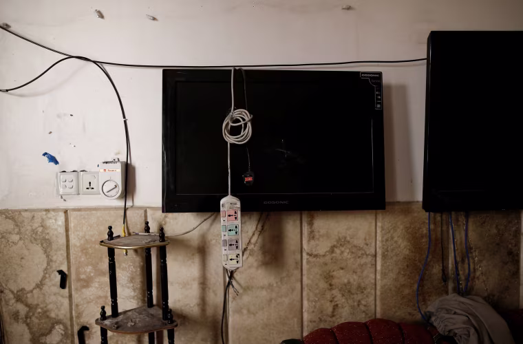 Image: Damaged surveillance monitors are seen in the control room in a compound used as a prison by Islamic State militants