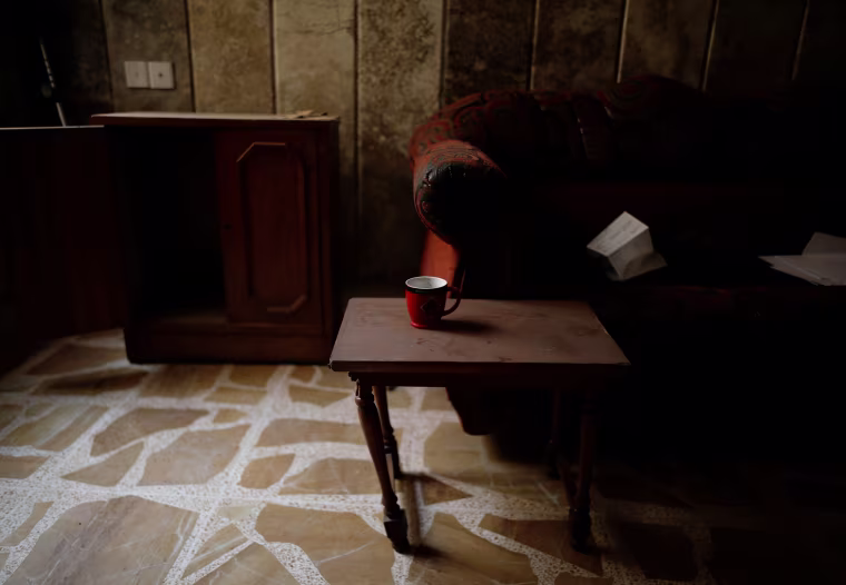 Image: A coffee mug is seen on a table at a compound used as a prison by Islamic State militants