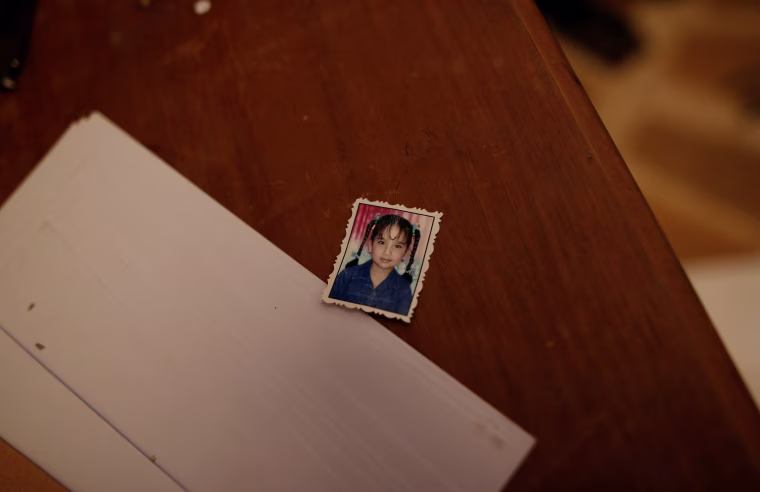 Image: The photo of an unidentified girl is seen on a desk inside a compound used as prison by Islamic State militants