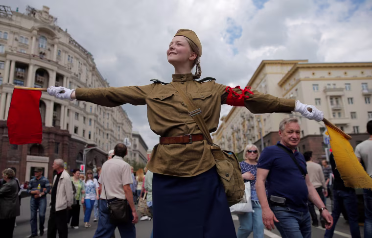 Image: A performer dressed in a historical uniform takes part in a re-enactment festival which coincides with an anti-corruption protest organised by opposition leader Alexei Navalny, on Tverskaya Street in central Moscow