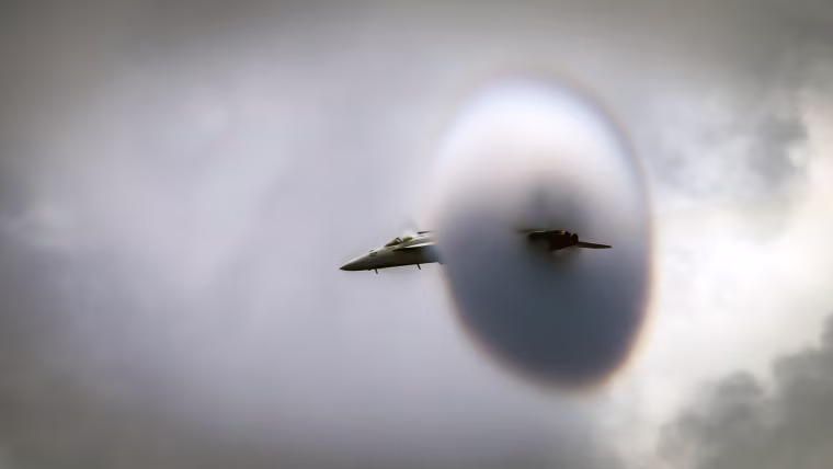 Image: A fighter aircraft conducts a high-speed flyby