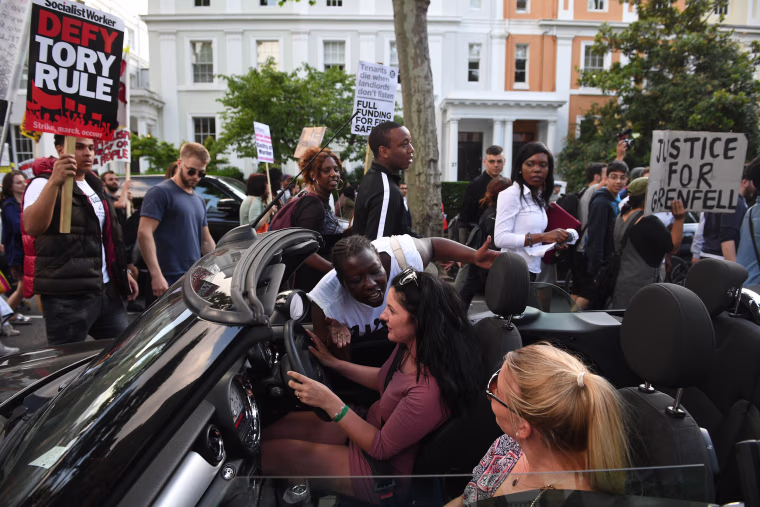 Image: Protestors march towards Grenfell Tower
