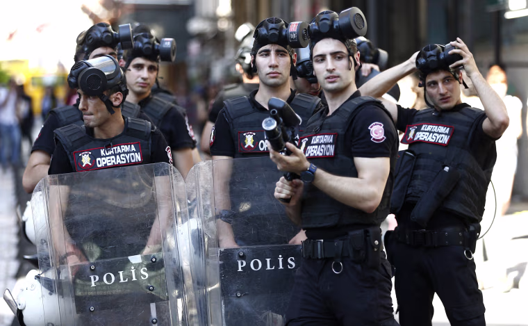 Image: Police stand guard near Taksim Square during the LGTB Pride Parade which was cancelled in Istanbul,