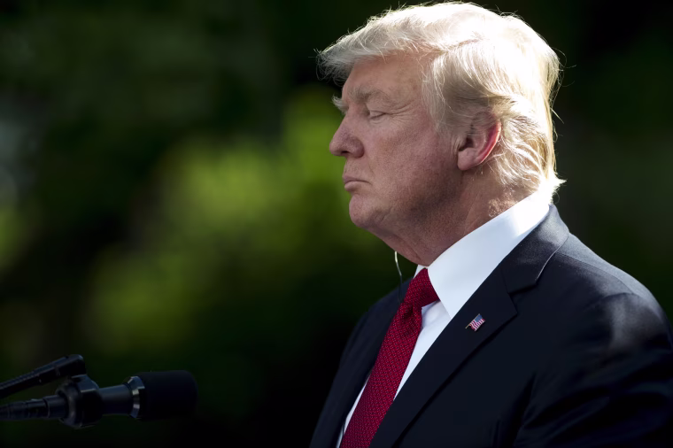 Image: Trump attends a press conference in the Rose Garden
