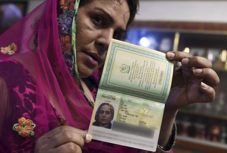 Image: Pakistani transgender Farzana Riaz displays her newly-obtained passport in Peshawar on June 28, 2017.