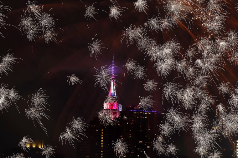 Image: The Empire state Building is seen during the Macy's 4th of July fireworks show from Queens