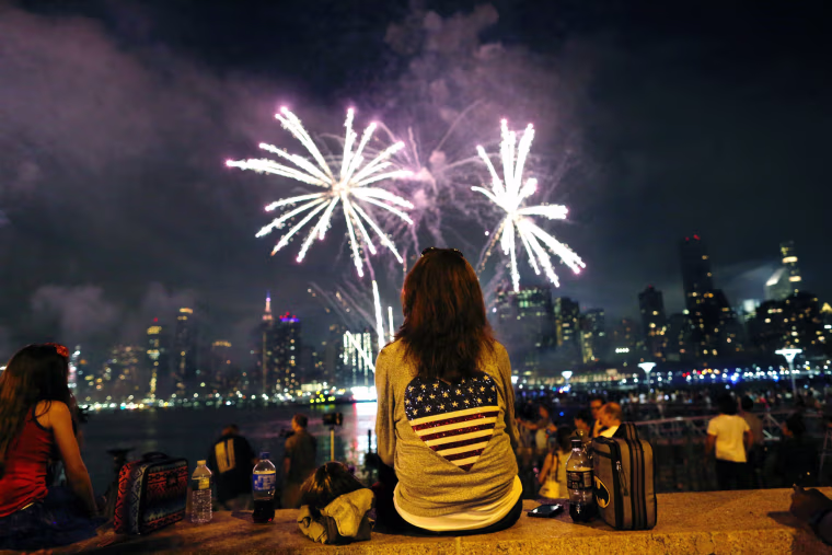 Image: People watch the annual Macy's 4th of July fireworks show from Queens