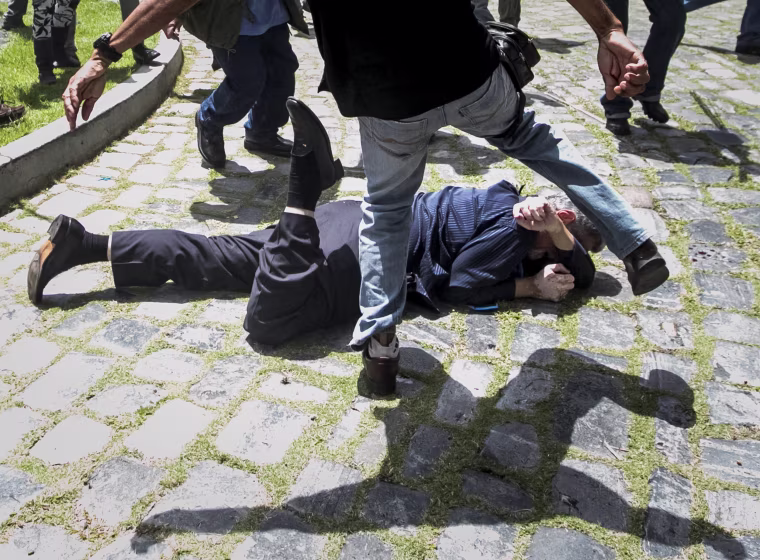 Image: Government supporters break into Venezuelan Parliament and wound deputies