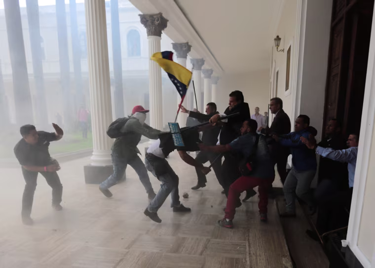 Image: Opposition lawmakers brawl with pro-government militias who are trying to force their way into the National Assembly