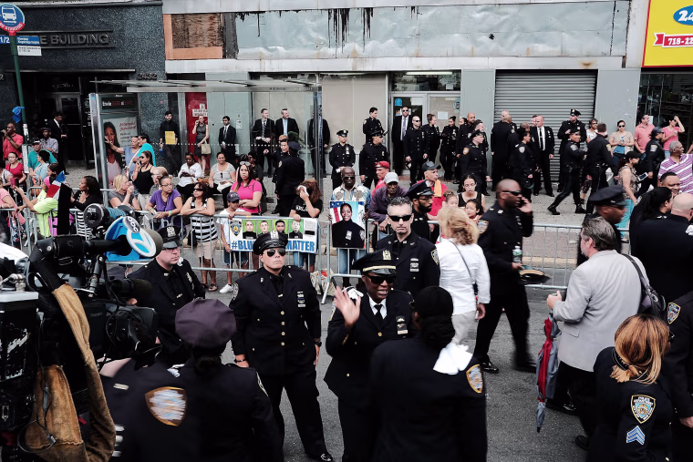 Image: Police officers stand outside of a Bronx church during the funeral for NYPD Officer Miosotis Familia