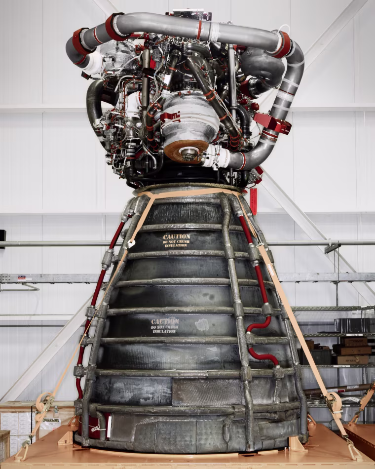 A space shuttle main engine on rolling stand.