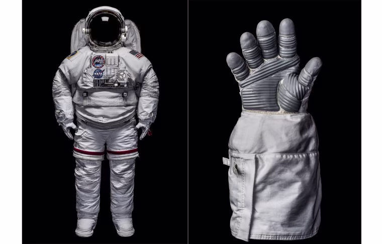 An Extravehicular Mobility Unit (EMU) space suit and glove.