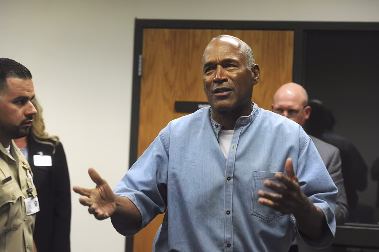 Former NFL football star O.J. Simpson reacts after learning he was granted parole at the Lovelock Correctional Center in Lovelock, Nev., on Thursday, July 20, 2017. 
