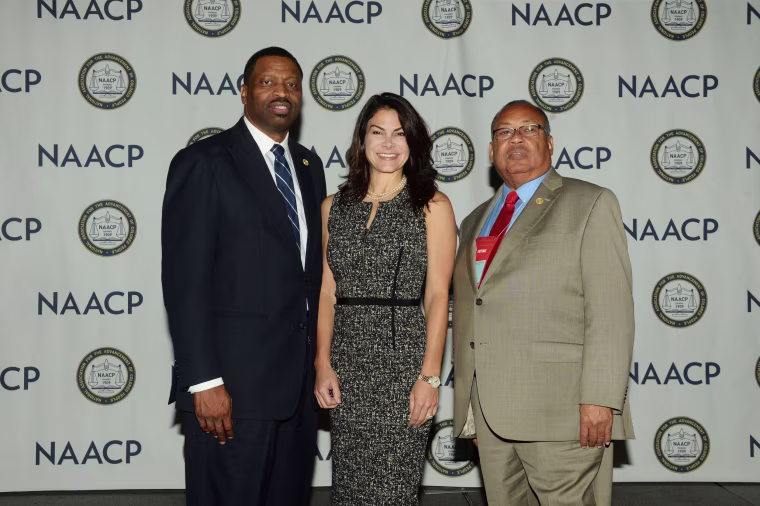 Image: Derrick Johnson, Interim President and CEO of the NAACP, from left, Belinda Johnson, Airbnb's Chief Business Affairs Officer and Leon Russell, Chair of the NAACP Board.