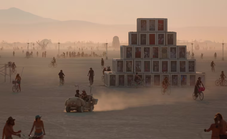 Image: Participants travel across the playa as approximately 70,000 people from all over the world gathered for the annual Burning Man arts and music festival in the Black Rock Desert of Nevada