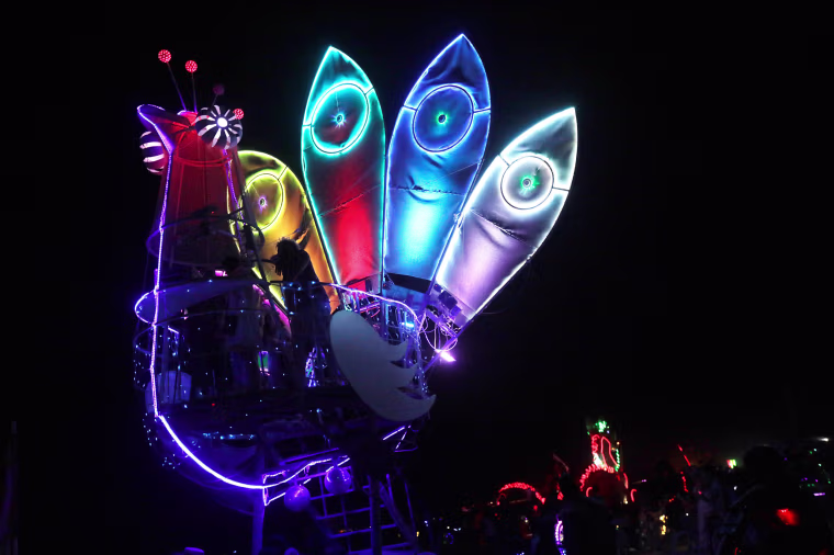 Image: Burning Man participants ride an art car ride across the desert at night on the 3rd day of the 2017 Burning Man festival in the Black Rock Desert of Nevada