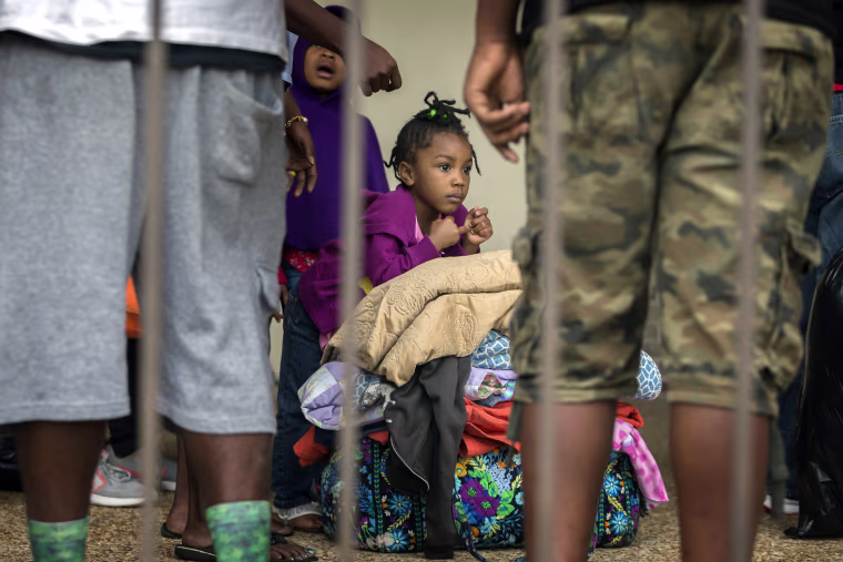 Image: An unidentified little girl waits with her family at the Savannah Civic Center to evacuate from he path of Hurricane Irma, Sept., 9, 2017 in Savannah, Georgia.