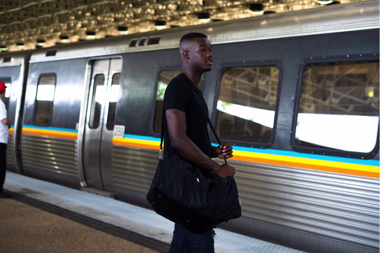 Image: BRWN Stock Image, man waiting for train