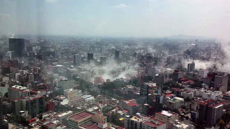 Image: Dust rises over downtown Mexico City during the earthquake